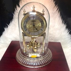 BULOVA,QUARTZ CLOCK WITH GENUINE LEAD CRYSTAL BASE